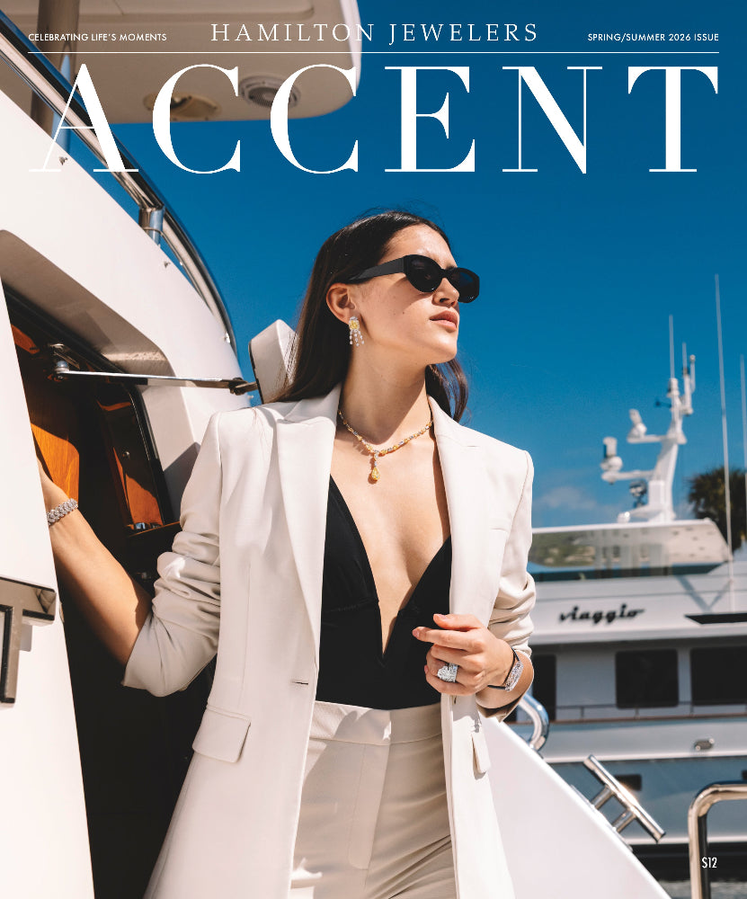 Woman in stylish outfit on a yacht with 'Hamilton Jewelers' magazine cover