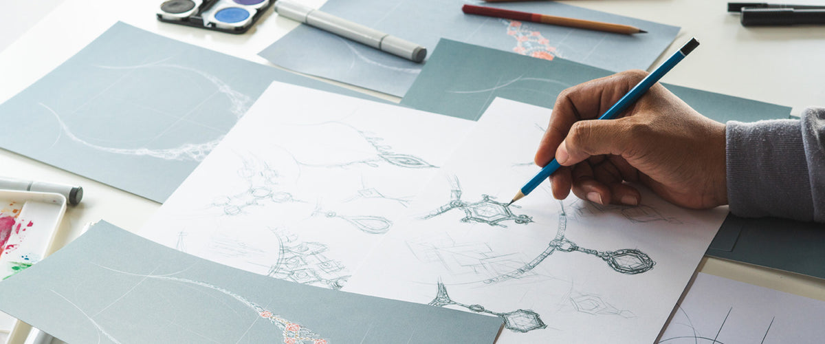 A Hamilton designer sketching a custom jewelry piece