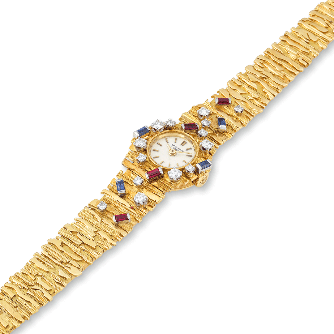 PATEK PHILIPPE YELLOW GOLD, DIAMOND, SAPPHIRE AND RUBY BRACELET WATCH, REF. 3289/24J