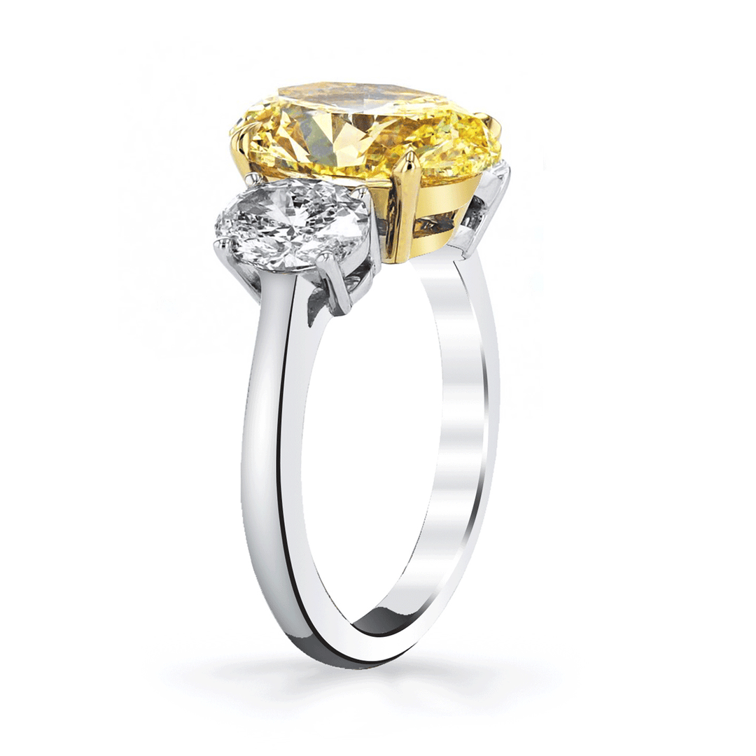 Platinum and 18k Gold 3 Stone Fancy Yellow Diamond 4.04 Total Weight Ring