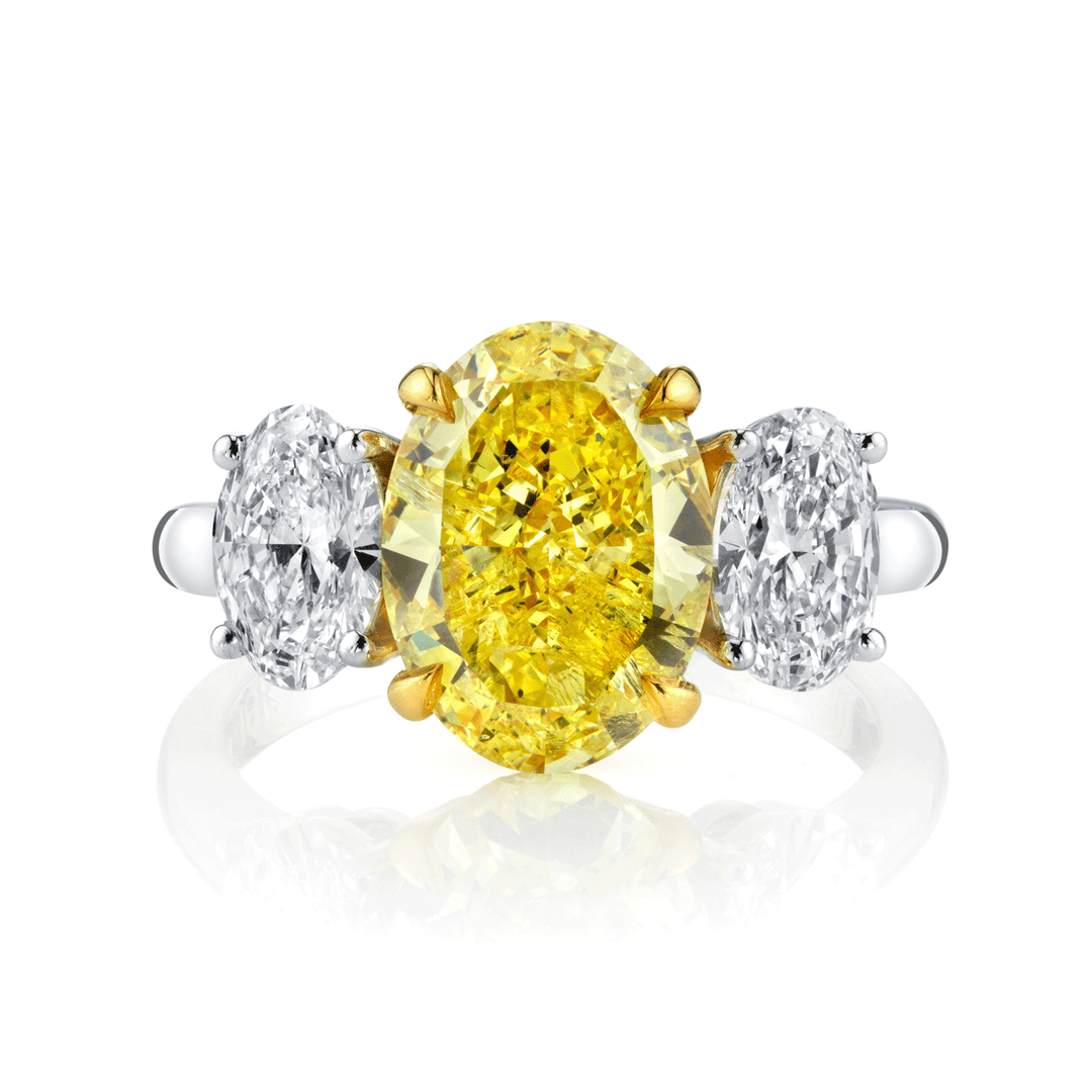 Platinum and 18k Gold Three Stone Fancy Yellow Diamond 4.04 Total Weight Ring