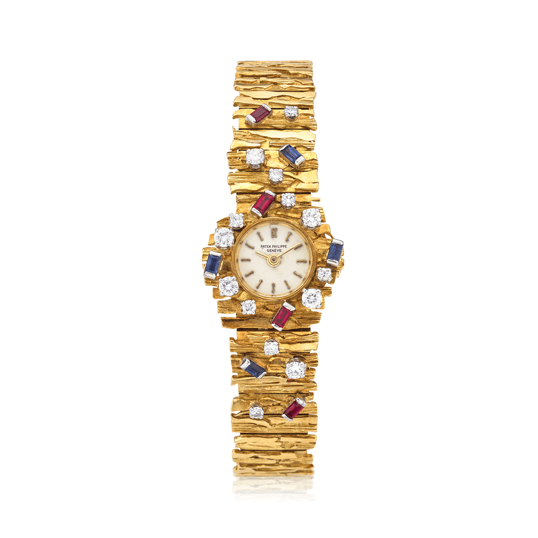 PATEK PHILIPPE YELLOW GOLD, DIAMOND, SAPPHIRE AND RUBY BRACELET WATCH, REF. 3289/24J
