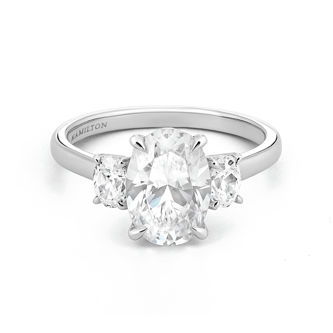 Platinum and 1.50 Total Weight Oval Diamond Three Stone Ring