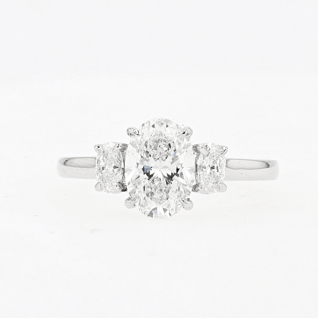 Platinum and 1.50 Total Weight Oval Diamond Three Stone Ring